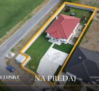 Family house in Vozokany with a red roof and a landscaped lawn for sale.