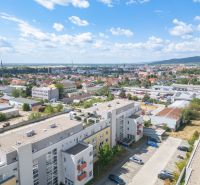 Aerial view of a 1-bedroom apartment in Pezinok, Silvánová, surrounded by residential buildings and greenery.