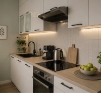 A kitchen in a 2-room apartment with wooden decor, decorations, and greenery.