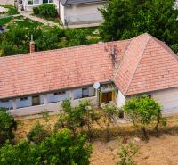 A family house in Kapince with a clay roof and a garden.