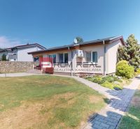 A family house in Turany with a well-maintained garden, swimming pool, and gazebo.