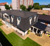 A family house in Senec with a well-maintained garden and a paved terrace in the suburbs.