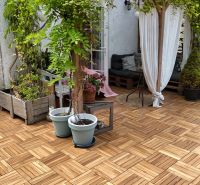 Terrace with seating and flowers, floor with wooden decor, pleasant garden environment.