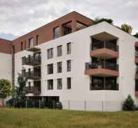 The building on Brigádnicka Street in Piešťany with balconies and greenery, suitable for a 3-room apartment.