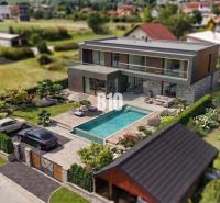 Luxury villa with a pool in Martin - Land - living, surrounded by greenery.