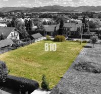 A plot for living in Martin with a view of houses and hills.
