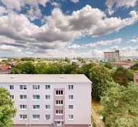 View of apartment buildings and the surrounding landscape in Senica on Palárikova Street.