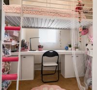 Children's room with a loft bed, a desk, and a floor with a wooden decor.