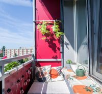 A balcony in a 2-room apartment in Trnava, with comfortable seating and a view.