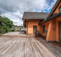 A family house in Veľká Lomnica with a terrace and wooden decor.