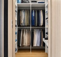 A wardrobe with clothes in a 3-room apartment, wooden decor, sliding doors.