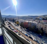 View from a 3-room apartment in Brezová pod Bradlom of the town and parking lot.