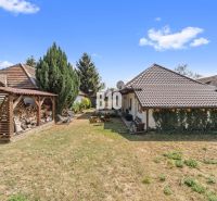 A family house in Podhájska with a landscaped garden and a woodshed for dry wood.