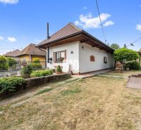 A family house in Podhájska with a well-maintained garden and traditional architecture.