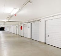 White garages with electric gates on Šustekova Street in Bratislava - Petržalka.