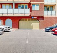 Parking in front of garages on Šustekova Street in Bratislava - Petržalka.