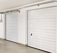 White garage doors in the premises of the Garage on Šustekova in Bratislava - Petržalka.