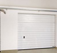 Garages with white garage doors, interior with functional mechanism.