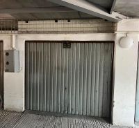 Closed iron garage doors in garages on Púpavová Street in Bratislava - Karlova Ves.