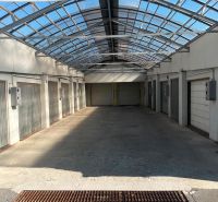 Garages on Púpavová Street in Bratislava - Karlova Ves with a glass roof.