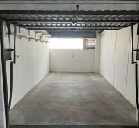 Spacious garage with a concrete floor on Púpavová Street in Karlova Ves, Bratislava.