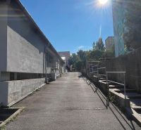 Access road to the garages on Púpavová in Bratislava, Karlova Ves on a sunny day.
