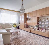Living room with a sofa set, display cabinet, and carpet in a 4-room apartment.