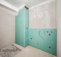 The construction state of the bathroom in a 2-room apartment with installation of plumbing prepared for equipment.