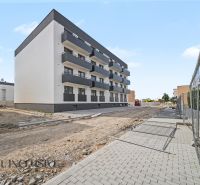Apartment building in Zlaté Klasy with four floors and balconies.