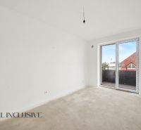 Empty room in a 2-room apartment, white wall, large window to the balcony.