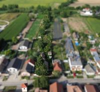 Aerial view of gardens and houses in the area of Plots - housing in Banská Bystrica.