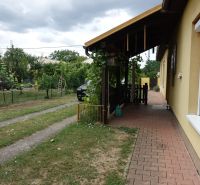 A family house on the Third Row in Mojmírovce with a garden terrace and a grass-covered plot.