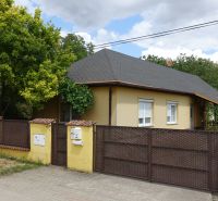 A family house in Mojmírovce on Tretí rad street, with a subtly coordinated fence and greenery.