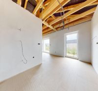 An unfinished room in a family house with plastering and preparation for electrical installation.