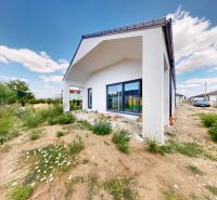 A family house in Senec on Karasova Street with a landscaped garden and terrace.