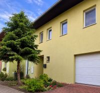 Family house on Hrabová Street in Hamuliakovo with a yellow facade and a garden.