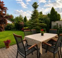 The terrace of a family house on Hrabová Street in Hamuliakovo with an outdoor table and chairs.
