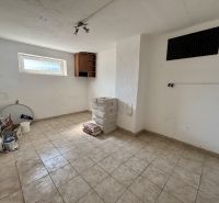 Room ready for renovation with tiles and tools, 3-room apartment.