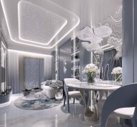 Interior of a holiday apartment with luxurious lighting, a dining table, and an elegant sofa.