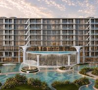 Recreational apartment in Pattaya with a water fountain and modern architecture in a tropical setting.