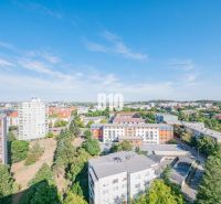 View from a 3-room apartment of the city of Nitra, with diverse architecture and greenery.