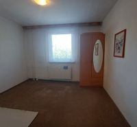 A room in a 3-room apartment with white walls and a wardrobe.
