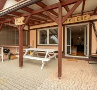 Terrace of a 2-room apartment in Poprad with seating and a grill.