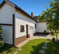 A family house on 29th August Street in Trebišov with a landscaped garden and paving.