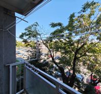 The balcony of a 1-room apartment on Hollého Street in Michalovce with a view of the parking lot.