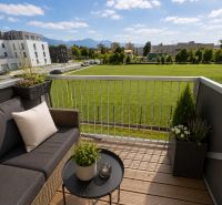 The balcony of a 3-room apartment in Liptovský Mikuláš with a view of greenery and mountains.