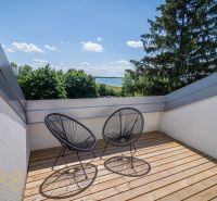 Balcony of a recreational apartment in Zemplínska Šírava with a view of the lake and greenery.