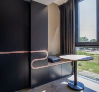 Minimalist interior with a window, wooden decor flooring, vacation apartment.