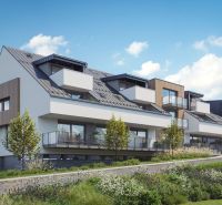 Apartment complex in Mlynica with green gardens and glass balconies.