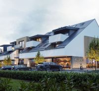 A building with modern architecture and cars in Mlynica.